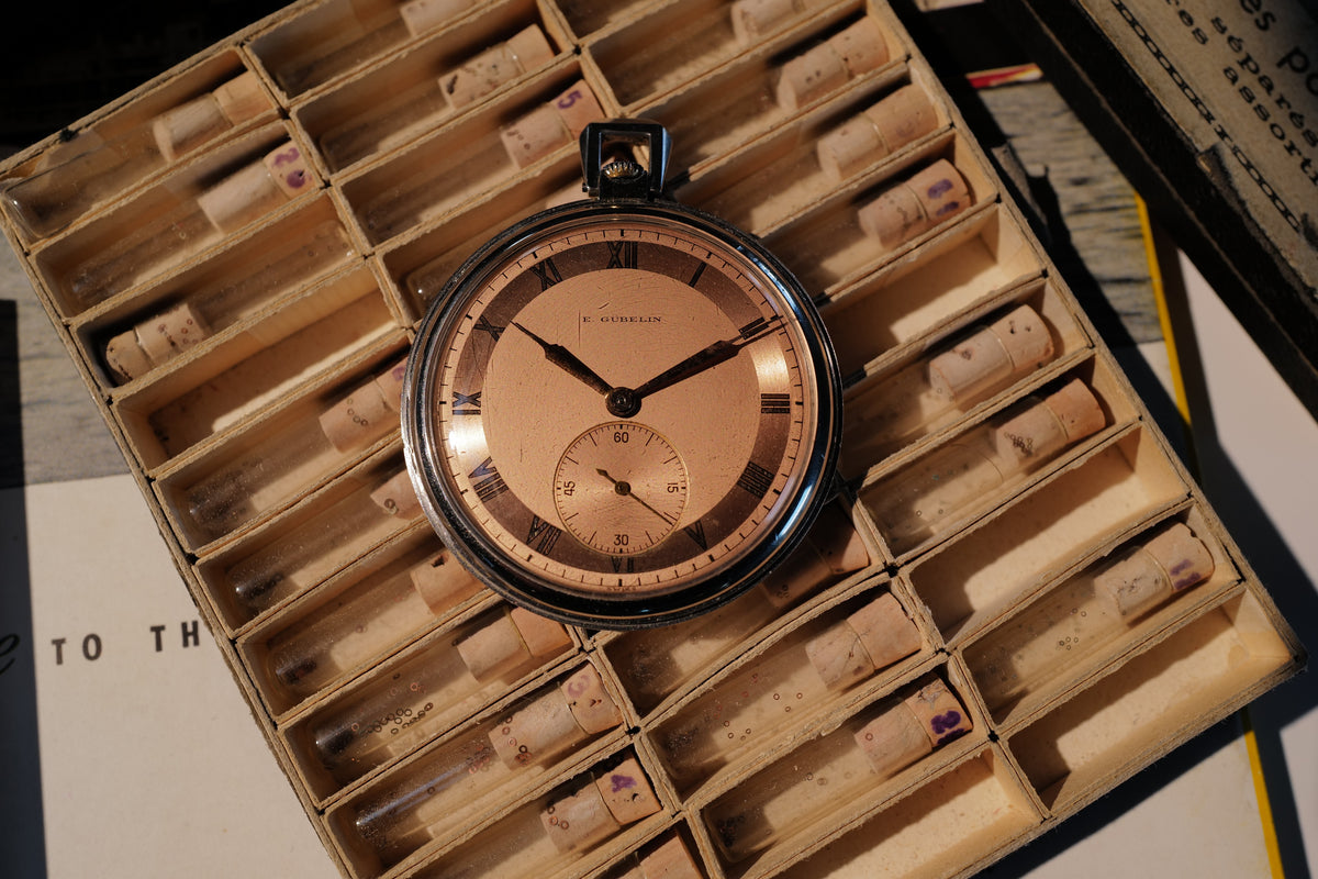 E. Gübelin – Rare Salmon Two-Tone Roman Dial Steel Pocket Watch, 46mm, circa 1930s